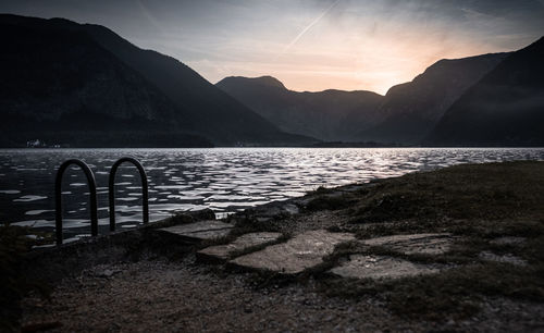 Scenic view of lake against sky during sunset