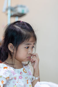 Portrait of cute girl looking away