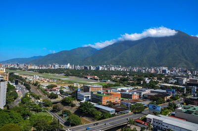 High angle view of townscape against blue sky