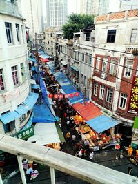 High angle view of people at market in city