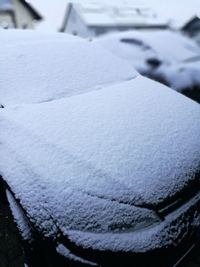 Close-up of snow on car during winter