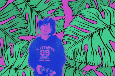 Man standing against blue wall