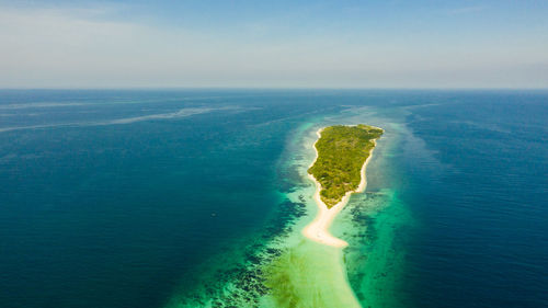 Tropical island with sand beach, top view. little santa cruz island near zamboanga city. 