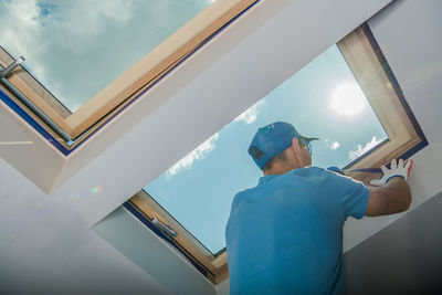 Rear view of man working at home