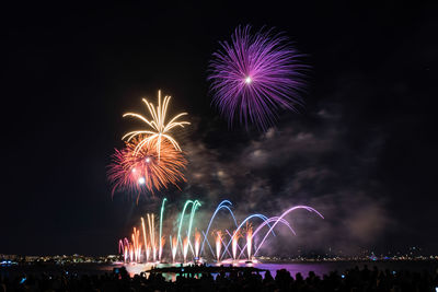 Fireworks glowing in the night for the 14th of july celebrations, cannes, cote d'azur, france