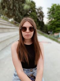 Portrait of beautiful young woman wearing sunglasses