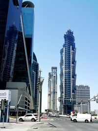 Modern buildings in city against clear sky