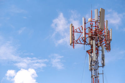 Low angle view of communications tower against sky