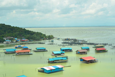 Boats moored at harbor