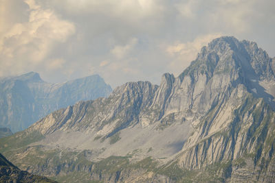 Scenic view of snow covered mountains against sky