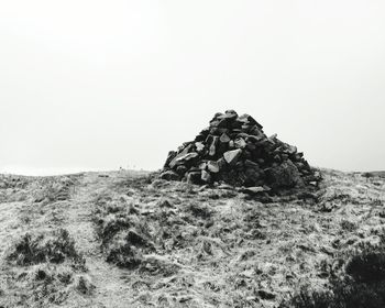 Rock formations on landscape against clear sky