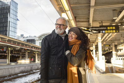 Mature couple on train station platform