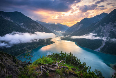 Scenic view of lake against sky during sunset