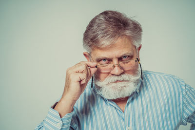 Portrait of man against white background