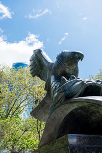 Low angle view of statue against sky