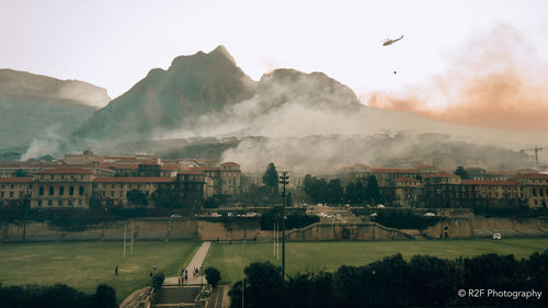 Scenic view of buildings in city against sky