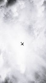 Low angle view of airplane flying in sky