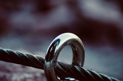 Close-up of metal ring in rope