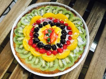 High angle view of colorful fruitcake on table