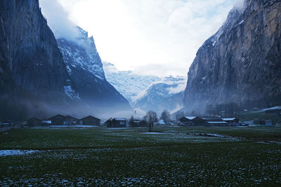 Scenic view of snowcapped mountains against sky