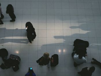 High angle view of people walking in corridor