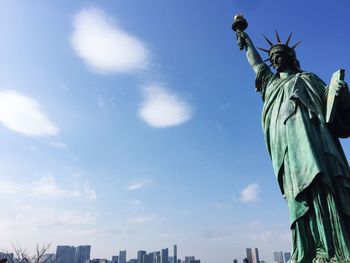 Low angle view of statue against cloudy sky