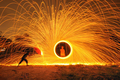 Full frame shot of illuminated lighting equipment at night