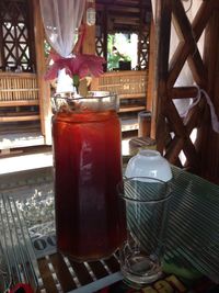 Glass of drink on table