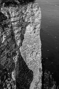 High angle view of rock formation in sea