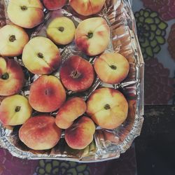 High angle view of apples in basket on table