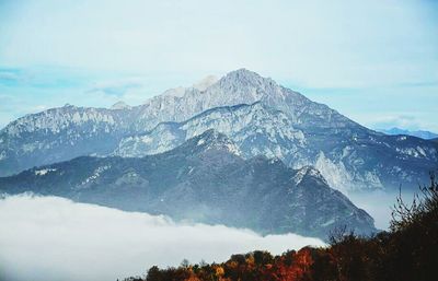 Scenic view of mountains against cloudy sky