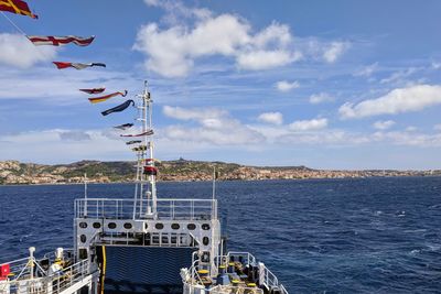 Ferry against blue sea against sky