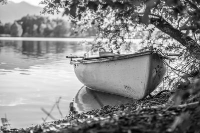 Boat moored in calm lake