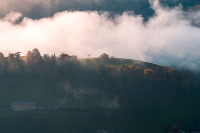 Panoramic view of trees and mountains against sky