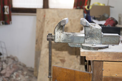 Close-up of bench vise at workshop