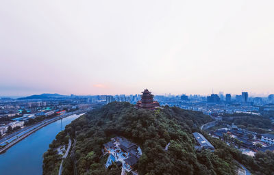 Aerial view of city buildings against sky