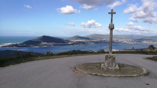 Road by sea against sky