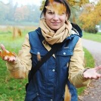 focus on foreground, casual clothing, grass, front view, relaxation, lawn, field, outdoors, person, looking at camera, day, footpath, grassy, young adult, carefree, park