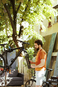 Side view of man with bicycle