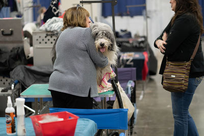 Rear view of woman with dog