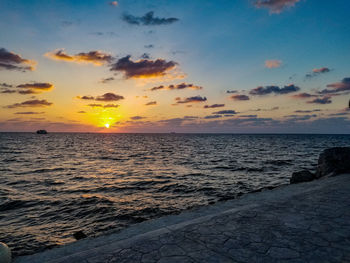 Scenic view of sea against sky during sunset