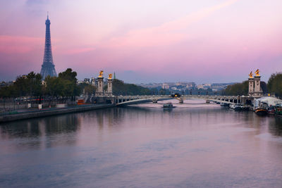 View of bridge over river against cloudy sky