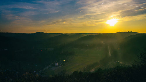 Scenic view of landscape against sky during sunset