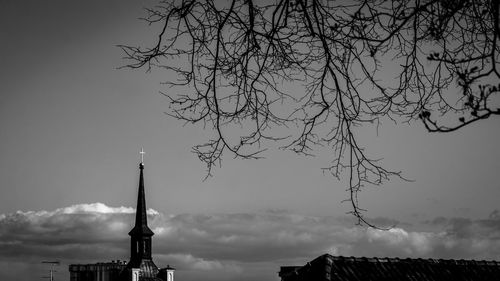 Low angle view of bare tree against sky