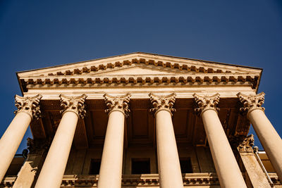 Low angle view of historical building against blue sky