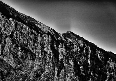 Low angle view of rock formation against sky