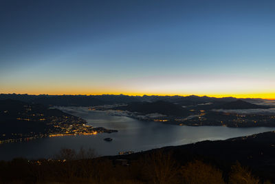 Scenic view of lake maggiore during sunset