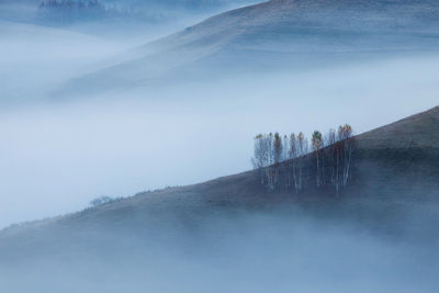 Scenic view of mountains during foggy weather