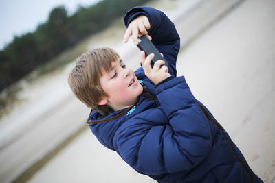 Boy using mobile phone