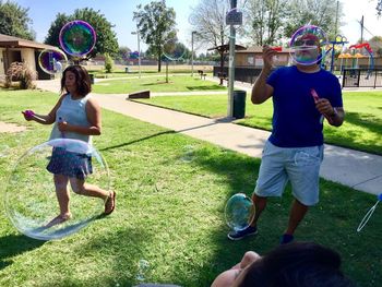 Full length of children playing in park